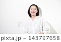 [White background] A Japanese woman in her 50s with a bright smile and cheerful expression in a video about beauty, naturalness, happiness, and a positive outlook. 143797658