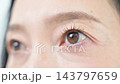 Beauty image for middle-aged women: wrinkles around the eyes, aging skin, eye care and anti-aging care - slowly opening the eyes. 143797659
