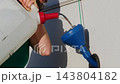 Woman Refilling Camper Rv Water Tank. 143804182