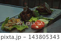 Grilled Meat and Seafood Served on Slate Plate at Restaurant 143805343