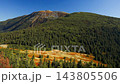Majestic autumn mountain landscape with pine forest and blue sky 143805506