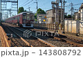 A Hankyu Takarazuka Line 2000 series train running near Ikeda-Ishibashi in the morning. 143808792