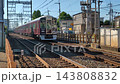 A Hankyu Takarazuka Line 9000 series train running near Ikeda-Ishibashi in the morning. 143808832