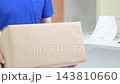 A video showing a Japanese male delivery driver carrying large cardboard boxes during his delivery job shows his hands (faceless) as he loads, unloads, and transports the packages. 143810660