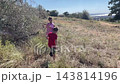 Kids explore outside, Youthful explorers cross extensive illuminated open land beneath blue sky, Children and young ones wander across vast sunlit plains under clear sky and bright sunlight 143814196