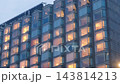 aUG 22 2026 Spacious modern hotel room with large glass windows overlooking a scenic urban cityscape skyline 143814213