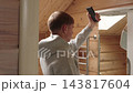 Man Taking Photo Of Scalp With Smartphone And Checking Hair Loss On Screen In Bathroom. Self Check, Hair Loss Tracking And Telemedicine Concept 143817604