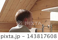 Man Applying Hair Growth Spray To Scalp In Bathroom. Hair Loss Treatment, Scalp Care And Daily Hair Care Routine Concept. 143817608