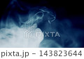Blue-gray smoke swirls drifting and billowing from the side over black background, thick atmospheric fog overlay for video editing, horror scenes, mystery and transitions 143823644
