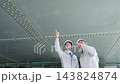 Workers inspecting equipment. Construction, inspection, repair, maintenance, upkeep, building, teamwork, contractors, personnel, safety 143824874