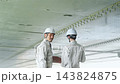 Workers inspecting equipment. Construction, inspection, repair, maintenance, upkeep, building, teamwork, contractors, personnel, safety 143824875