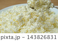 Organic curd cheese pouring from spoon slow motion 143826831