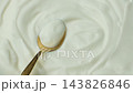 Culinary sour cream milky background. Spoon full of sour cream. Space for text. 143826846