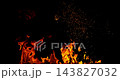 Fire and glowing sparks captured in extreme super slow motion at 1000fps on a cinematic high-speed camera against a pure black background, creating a dramatic VFX overlay. 143827032