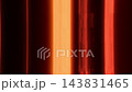 Abstract luminous bands flow across dark screen, changing position and intensity. Orange and scarlet light trails create energetic, mysterious motion graphic with sleek futuristic aesthetic. 143831465