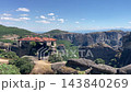 Aerial view of Holy Monastery of Great Meteoron built on high cliff surrounded by rocky pillars and green valley in Meteora Thessaly Greece landscape. 143840269