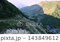 Winding road through mountain valley in autumn 143849612