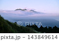 Mountain peaks emerging from thick fog in autumn 143849614