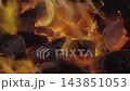 Glowing embers and burning charcoal in a fire 143851053