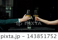 Couple Clinking Glasses During Dinner at Restaurant. 143851752