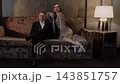 Elegant Couple Sitting Together on Sofa in Luxury Interior. 143851757