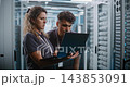Network Engineers Analyzing System Telemetry Together in Data Center 143853091