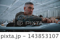 Professional Engineer Installs Electronic Components inside Unmanned Fixed Wing Aircraft 143853107