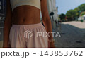 Close-up of woman wearing summer trousers 143853762