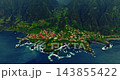 Aerial view of a small, picturesque village situated on an ancient volcanic formation that extends into the ocean and is washed by the waves of the Atlantic, on the island of Madeira, Portugal 143855422