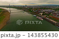 Aerial view of the beautiful city of Dusseldorf on the banks of the Rhine, featuring modern architecture and commercial port waterways 143855430