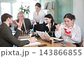 Female office worker eats noodles while other employees are unhappy with her behavior  143866855