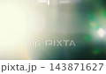 Cream and white anamorphic glare with curved arcs, horizontal prismatic streaks and green lens reflections on dark teal background, cinematic light leak overlay for video editing 143871627
