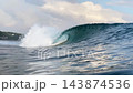 4K slow motion action shot of breaking ocean wave tube and white foam 143874536