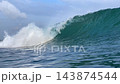 Scenic close up view of tropical turquoise wave breaking in open ocean 143874544