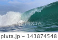 Close up of powerful ocean wave curling and breaking in turquoise sea 143874548