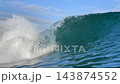 Close up of powerful ocean wave curling and breaking in turquoise sea 143874552