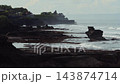 Serene Spiritual Shrine Situated Atop Rugged Cliffs During Early Morning Light 143874714