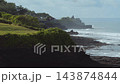Serene Dawn Silhouette Standing Near Foggy Ocean Edge With Temple 143874844