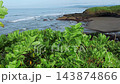 Quiet Shoreline Featuring Black Sand And Rocky Pools In Morning Light 143874866