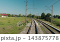 View from a Moving Train on Curving Electrified Railway Tracks 143875778