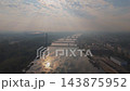 Aerial Drone Footage of Warsaw Cityscape at Sunrise featuring National Stadium, Bridges, and Vistula River 143875952