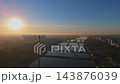 Aerial Drone Footage of Warsaw Cityscape at Sunrise featuring National Stadium, Bridges, and Vistula River 143876039