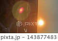 Vertical video. Sunset over a city bridge with cars moving through a distant urban background. Golden hour traffic, warm lens flare and evening cityscape 143877483