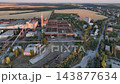 Rail sidings serving a steelworks scrap yard beside the steelmaking hall in a drone aerial view. Industrial logistics, steel manufacturing and railway freight access 143877634