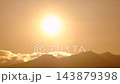 Time Lapse of the Sun Going Down Behind the Mountains.  143879398