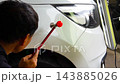 Removing dents on the car. PDR technology. Car body repair without painting. 143885026