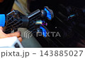 Removing dents on the car. PDR technology. Car body repair without painting. 143885027