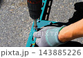 A man assembles a metal frame, concept of DIY, furniture assembly, craftsmanship 143885226