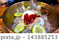 Korean cold noodles, naengmyeon. Cut the noodles with scissors 143885253