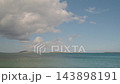 Wide Coastal Expanse With Soft Clouds, Turquoise Gradient Water Meeting Distant Islands, Calm Tide And Pastel 143898191